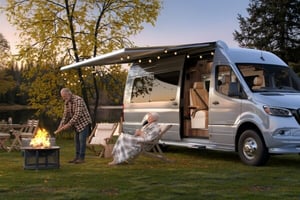 couple-with-rv-at-campsite-firepit